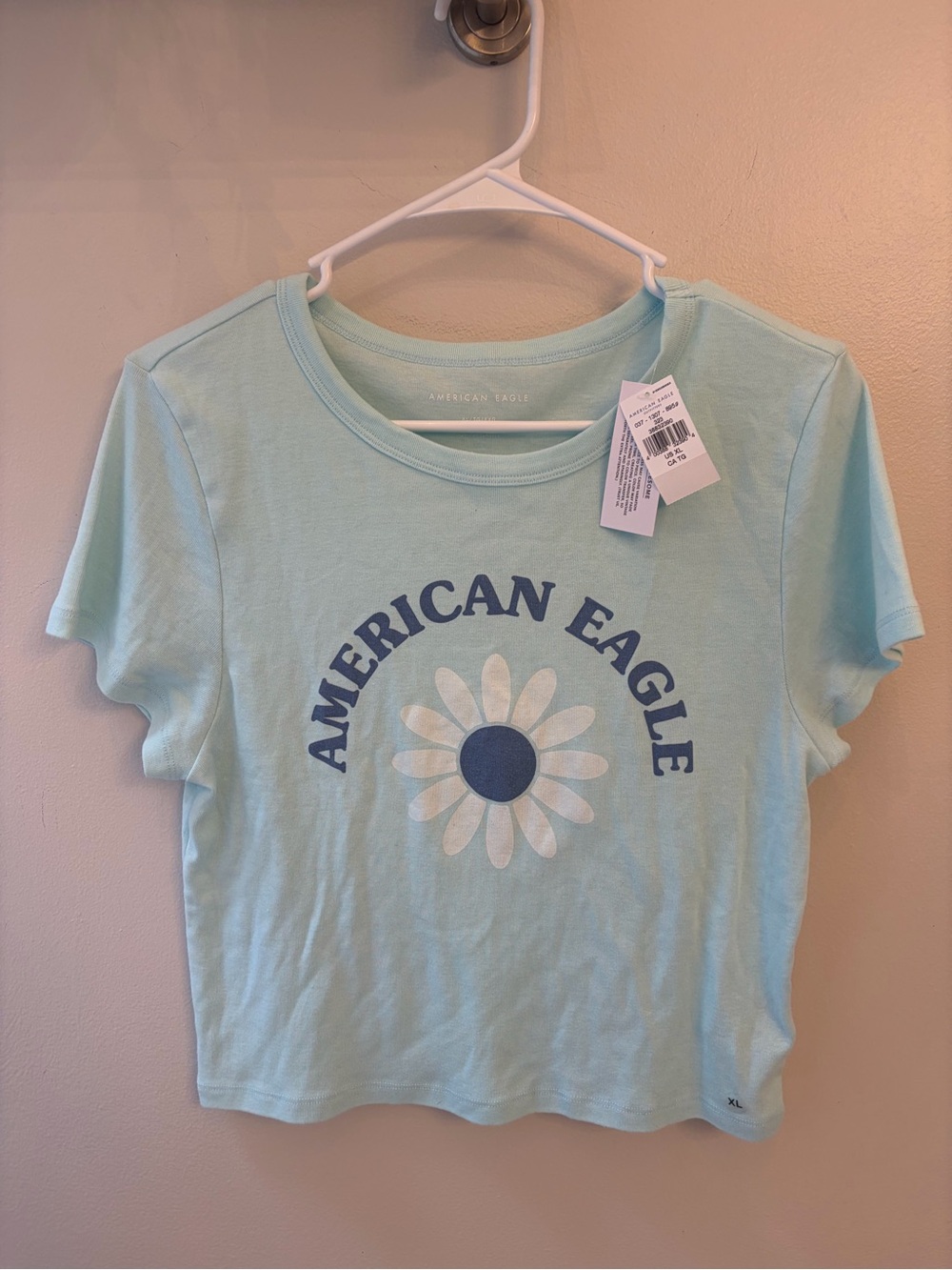 American Eagle Outfitters Light Blue Tee with Navy Logo and White Daisy girl XL